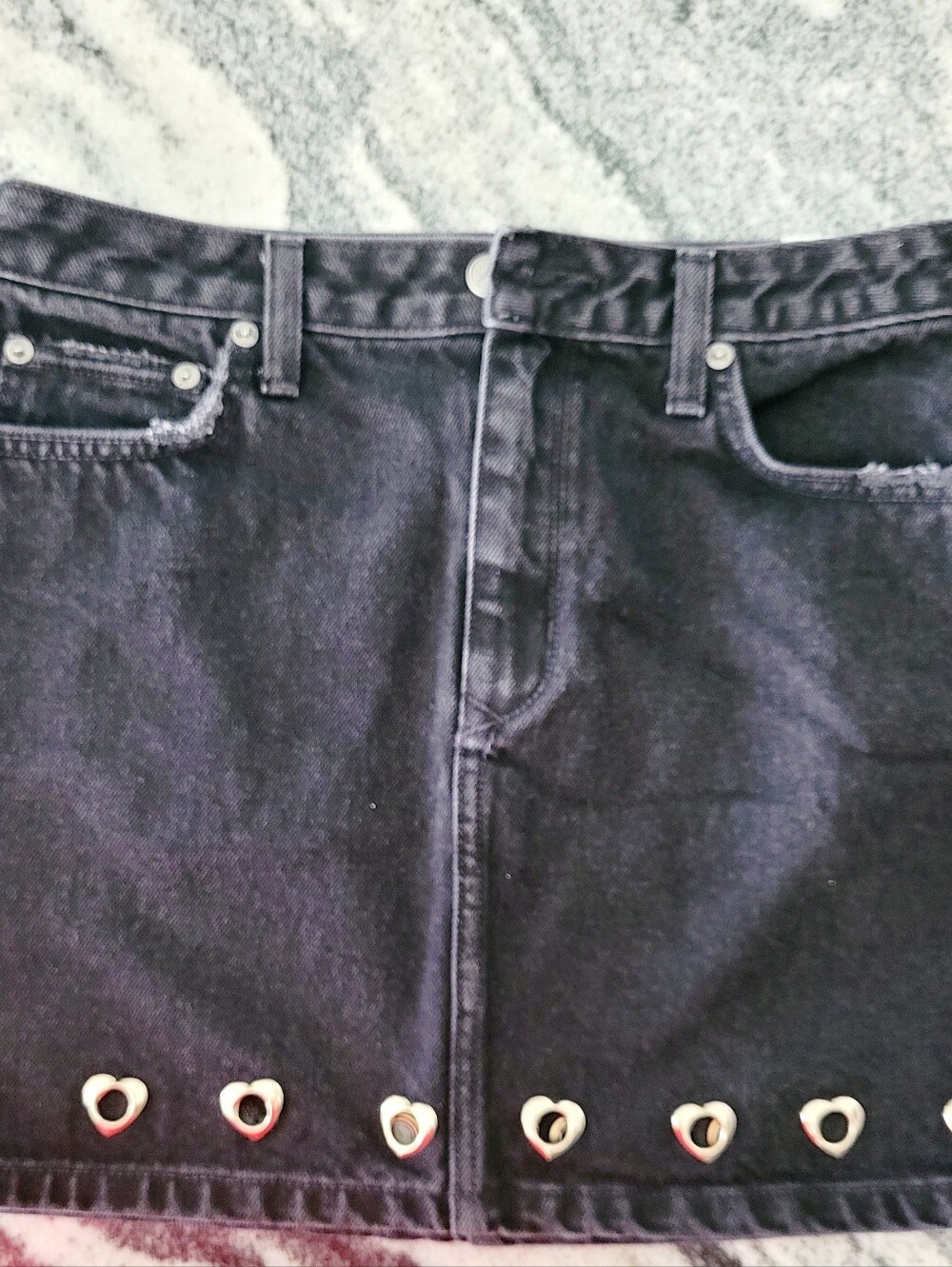Women’s Black Denim Mini Skirt with Heart Eyelet Trim